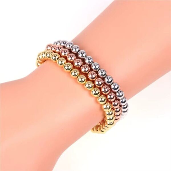 Juego de 3 pulseras de cuentas de metal con baño de oro tricolor de 14 k